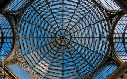 The dome of Galleria Umberto I. Galleria Umberto I is a public shopping gallery in Naples, a high and spacious cross-shaped structure, surmounted by a glass dome.