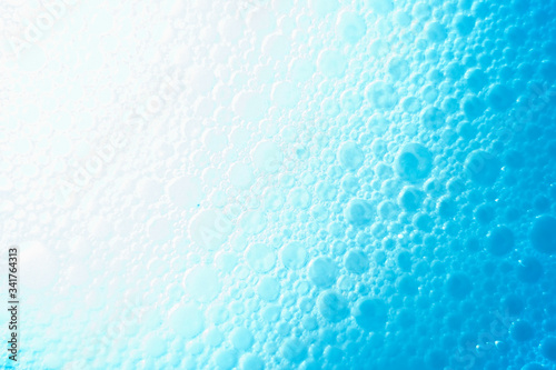 abstract background with bubbles oil drops on the water surface