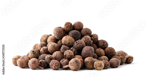 A pile of dried allspice on a white background. Isolated