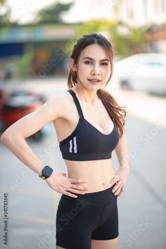 Asian beautiful woman wearing black workout clothes