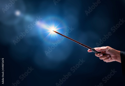 Magic wand on mysterious background, Miracle magical stick Wizard tool on black