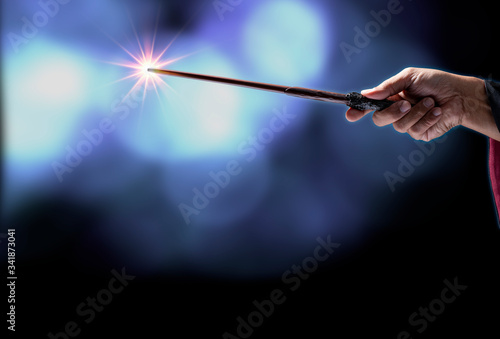 Magic wand on mysterious background, Miracle magical stick Wizard tool on black