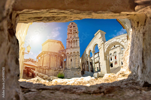 Ancien old Roman queen Jelena square and cathedral in Split view through stone window