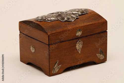 Jewelry box made of wood with additional workmanship and decorated. Wooden jewelry box. Wooden box made of aged wood.