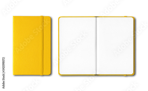 Yellow closed and open notebooks isolated on white