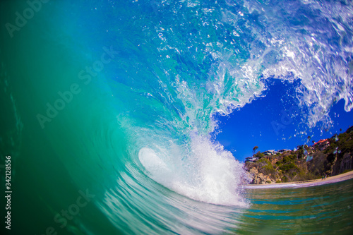 A wave breaks on a reef in a tropical paradise beach 