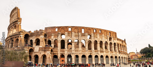 Rome Italy. Exterior of the Colosseum, famous for shows with gladiators in the Roman Empire, inserted in the new seven wonders of the world. Detail of the typical architectural arches and friezes.