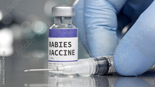 Rabies vaccine vial in medical lab with syringe