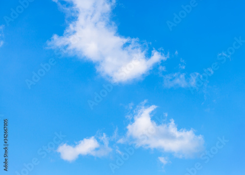 white clouds dissipating in blue sky