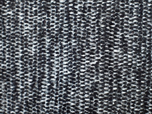 Black and white, hairy fabric with stripes and visible texture. background or texture, closeup.
