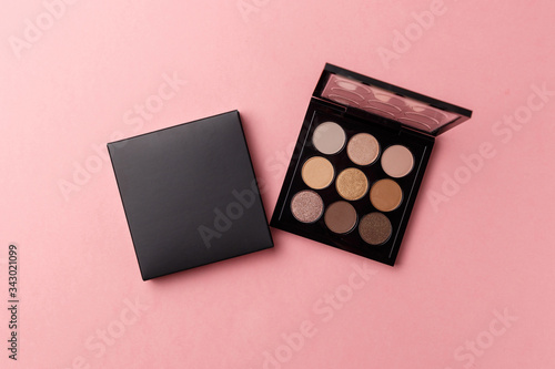 Mua and girly concept. Eyeshadow palette on pink background, eye shadows cosmetics product as luxury beauty brand promotion. Fashion blog design. Contouring palette. Makeup palette close up