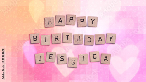 Happy Birthday Jessica card with wooden tiles text. Girls birthday card in rainbow colors. This image can be used for a eCard or a print postcard.