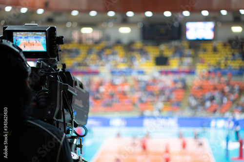 Blurred background of professional volleyball league cup championship international competition live sport news tv show from indoor arena with fans crowd cheer up and watching from stand for victory