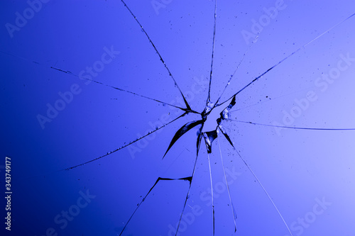 Broken glass of window in blue background