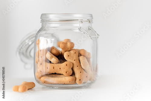 dog cookies in a jar on a light background