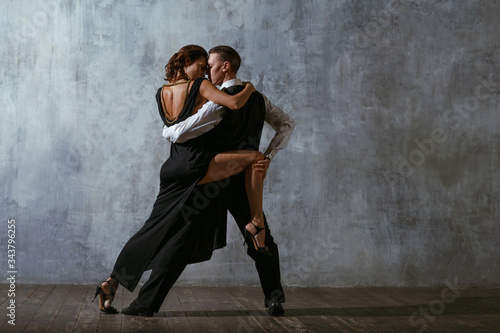 Tango pair dancers. Dance in ballroom.
