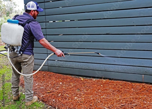 Pest Control Technician Spraying Insecticide