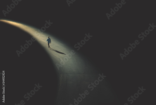 man walking in the night