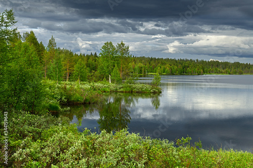 Picturesque summer landscape with heavy thunderclouds. Finnish Lapland, Suomi