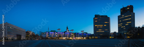 Cityscape or panorama of trg republike in the capital of Ljubljana, Slovenia, taken during blue hour in december, with visible decorations.