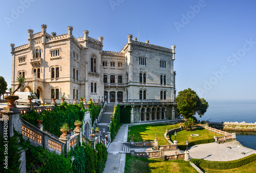 The Miramare Castle in Trieste, a nineteenth-century castle of white stone perched above the Adriatic sea. Italy