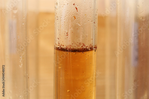 Weakly concentrated aqueous bromine solution in test tube.