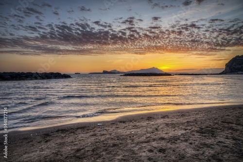 Beautiful shot of the beach of Capo Misento at sunset, Bacoli, Campania, Italy at sunset