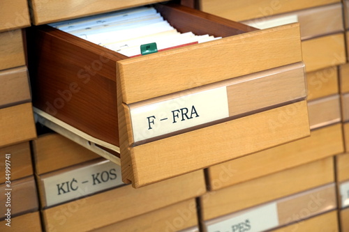 Wooden library drawer opened on letter F