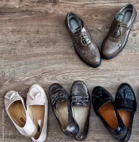 Loafers and other shoes retro style stand on the wooden floor.
