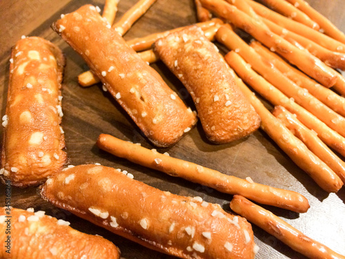 Pretzel sticks salted close up yummy snack on wood table