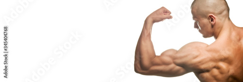 Close-up of a power fitness man's hand. Muscular bodybuilder flexing and showing his biceps - external side - on white background. Studio shot
