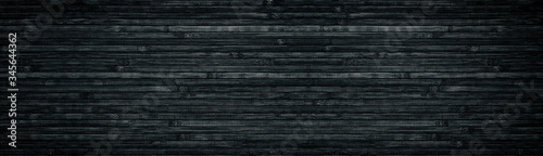 Black wood wide texture. Bamboo planks. Dark long background