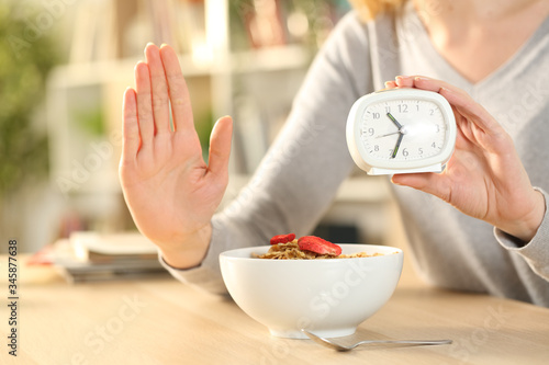 Woman hands on intermittent fasting doing stop sign