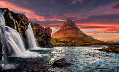 Incredible Nature landscape of Iceland. Fantastic picturesque sunset over Majestic Kirkjufell mountain and waterfalls. Church mountain, Iceland. Iceland the most beautiful and best travel place.