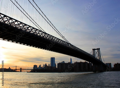 New york, USA - 20/12/2019: williamsburg bridge in New York Manhattan skyscrapers behind at sunset - stock photo