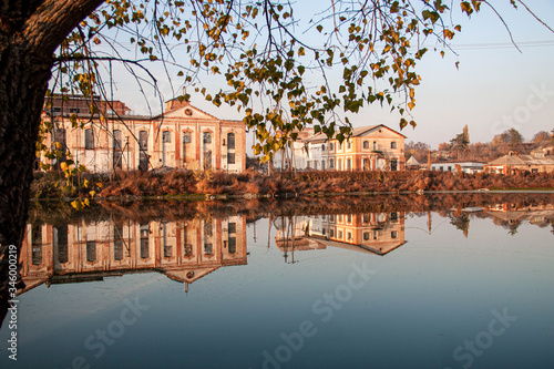 Reflection in the lake of an old factory in autumn 