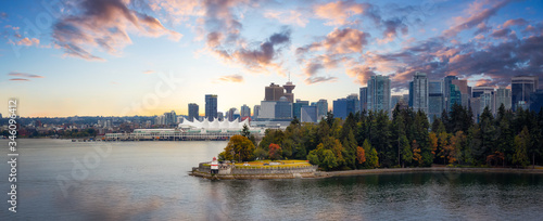 Vancouver, British Columbia, Canada. Beautiful Panoramic View of Modern Downtown City, Stanley Park and Coal Harbour. Colorful Sunrise Sky Composite. Cityscape Panorama