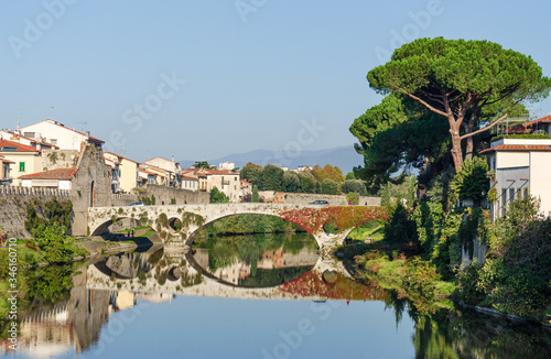 Old bridge over Bisenzio river landscape view in Prato Tuscany Italy in a sunny day 