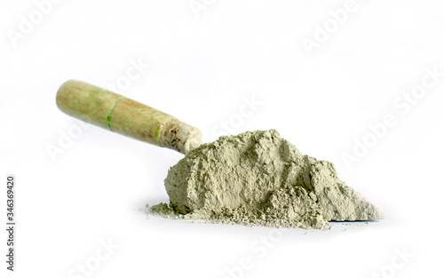Cement or mortar, including trowel, used for separate construction work on a white background.