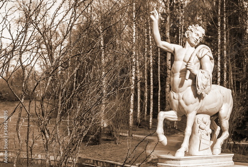 Marble sculpture of centaur (copy) on bridge in Pavlovsky Park. Sepia