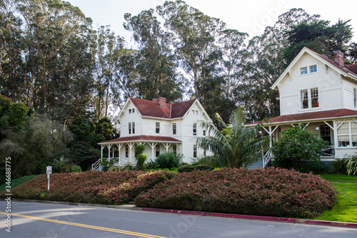 Historical military built building surrounded by tall eucalyptus trees. Presidio National Park, San Francisco