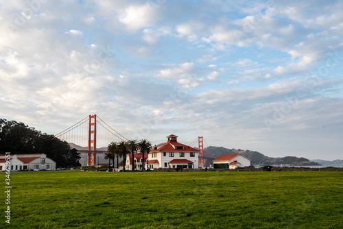 View to the Golden Gate Bridge from Crissy Field Park. White houses with red roof