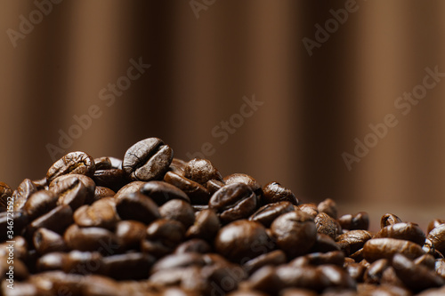 Roasted Coffee Beans texture on .Curtain background, macro.
