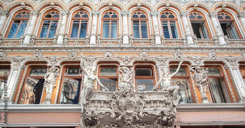 Facade of Passage, a historical building with baroque statues, sculptures and ornaments in the old town of Odessa, Ukraine June 2019 Central Europe