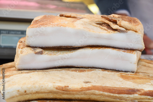 Romanian traditional salty pork belly specialty named slanina, on counter