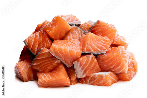 Fresh salmon fillet cubes isolated on white