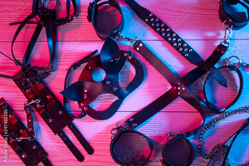 Set of erotic toys for BDSM. The game of sexual slavery with a whip, gag and leather blindfold. Intimate sex games