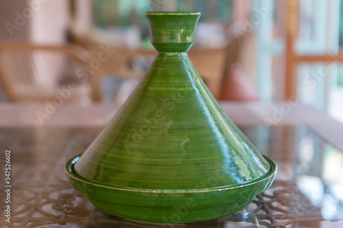 Green, traditional Moroccan ceramic tagine (tajine). Authentic, traditional expensive, high quality ceramic that can be used for cooking.