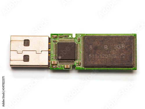 disassembled USB flash drive on white background, isolated. Illustrated the End of the Warranty Period of Electronic Device or Repair. Macro