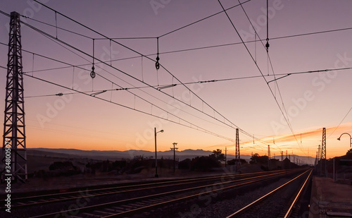 sunset on the train tracks in Avila, Spain